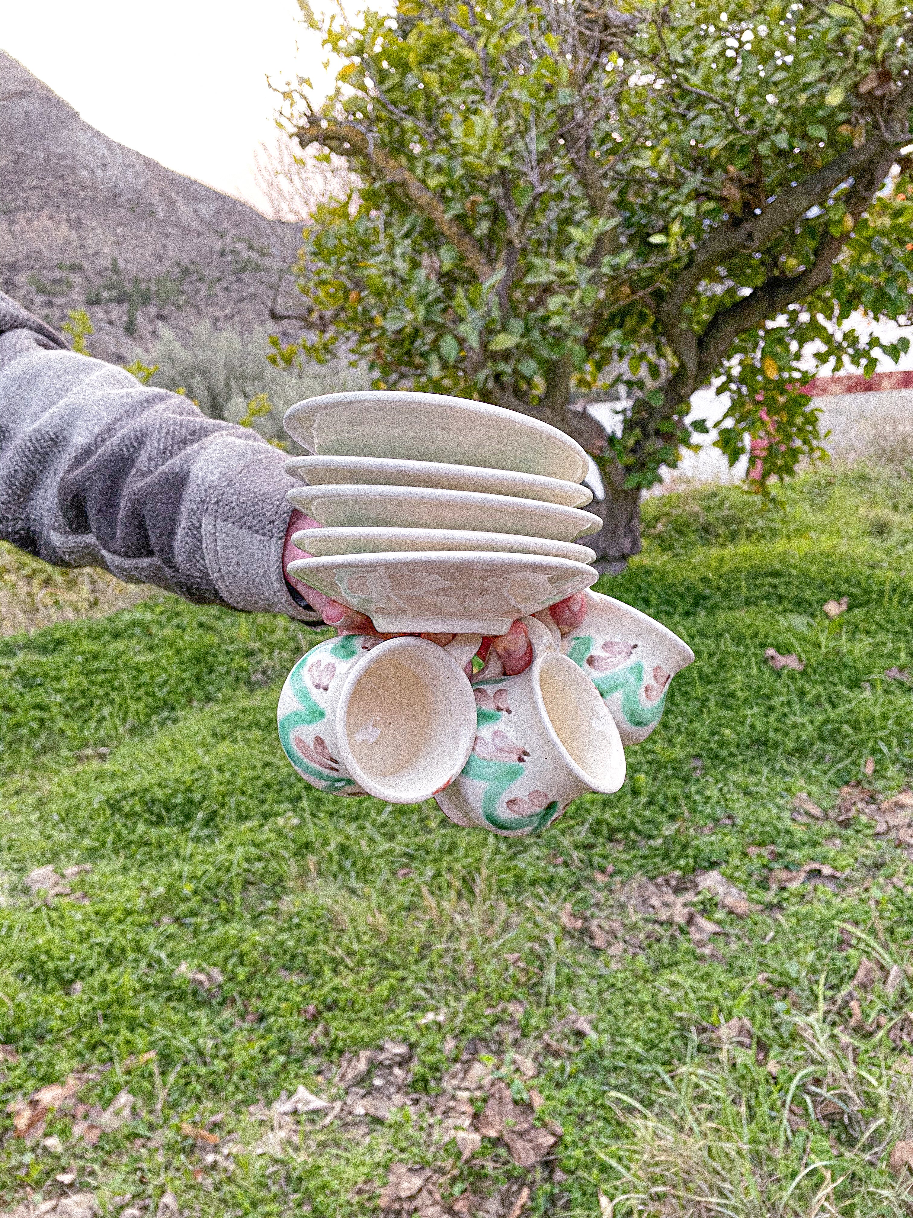 Green coffee cup with a plate